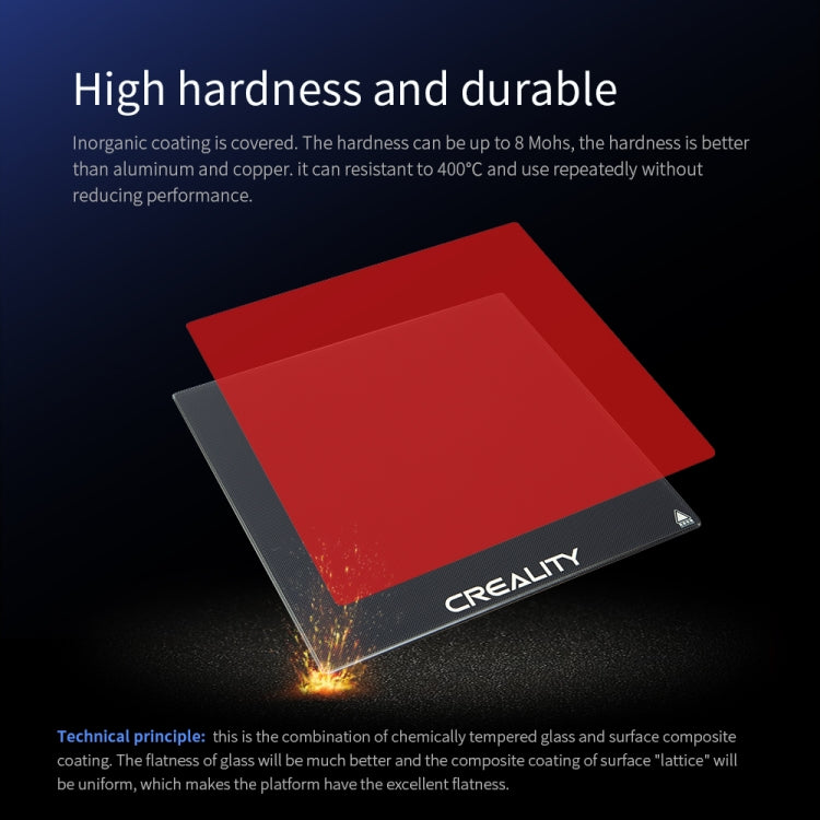 Heated glass build plate with dark surface, CREALITY logo, and corner warning icon