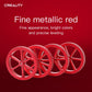 Cluster of red metal four-spoke hand-screw leveling wheels for a 3D printer bed