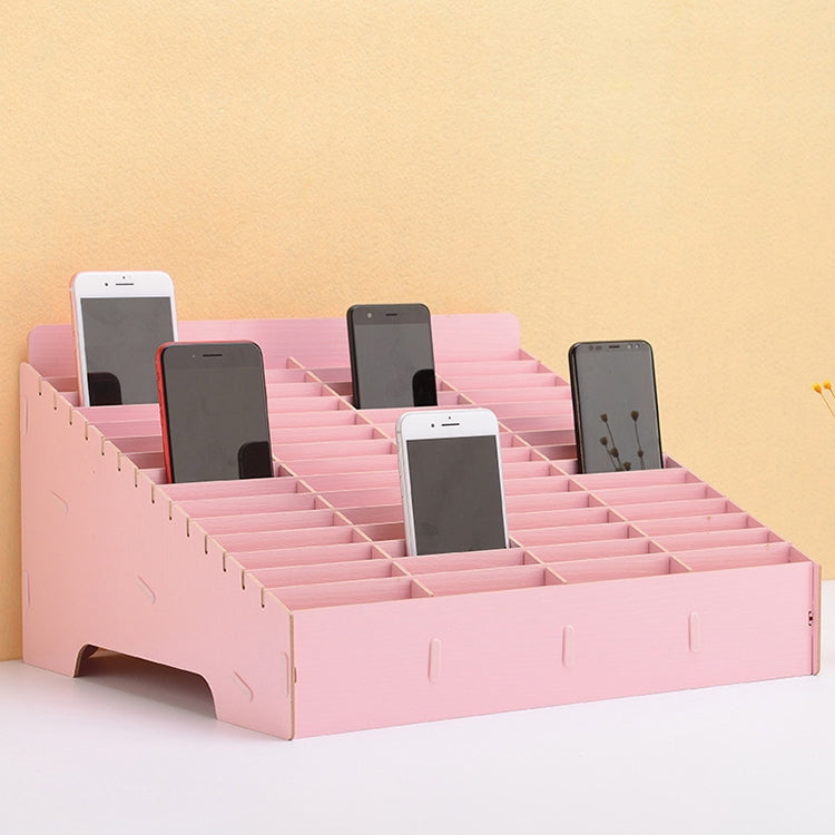 Pink desktop multi-cell phone display rack with 60 grids and three phones
