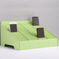 Green desktop multi-cell phone display rack with 60 grids and three phones