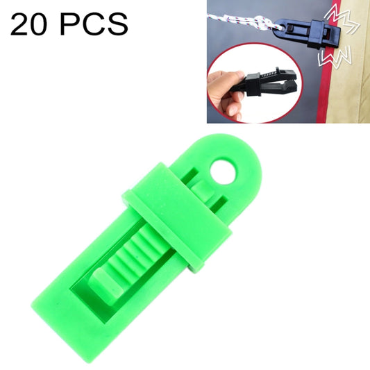 Green plastic tent awning securing clip with fixing buckle and rope slot.