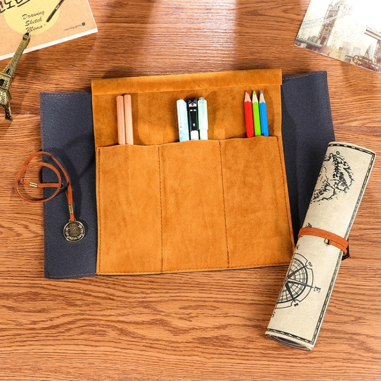 Suede-style pencil bag open with tan slots and blue side pouch; holds pens and cream map roll.