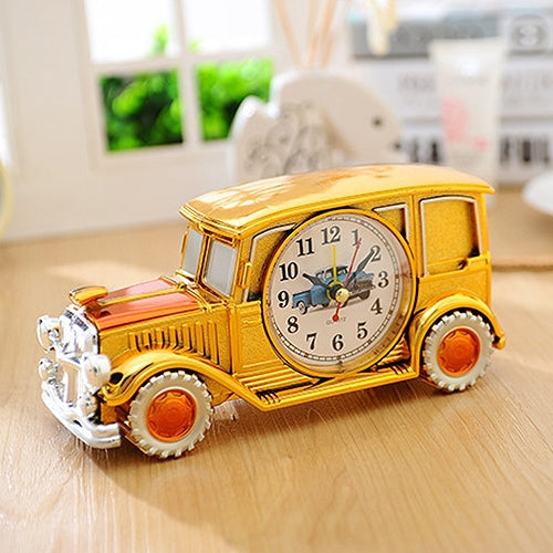 Vintage car model alarm clock, bright gold car body with round analog dial