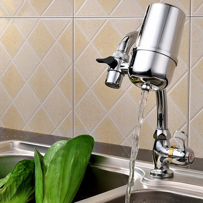 Kitchen water filter faucet with chrome finish and spout pouring water into sink