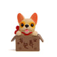 Cream bulldog doll in a brown cardboard box with paw and character prints