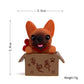Orange bulldog doll ornament in a brown cardboard box with red bow collar