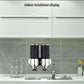 Dual wall-mounted manual soap dispenser with dark cylinders and chrome spouts on a backsplash