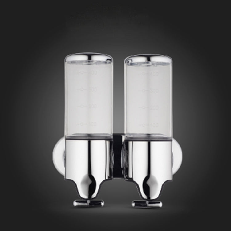 Dual wall-mounted manual soap dispenser, transparent twin bottles with chrome base