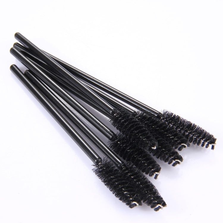 Disposable eyelash brush wands with dense black bristles on black handles