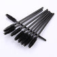 Multiple disposable eyelash mascara wands with black bristles on black handles