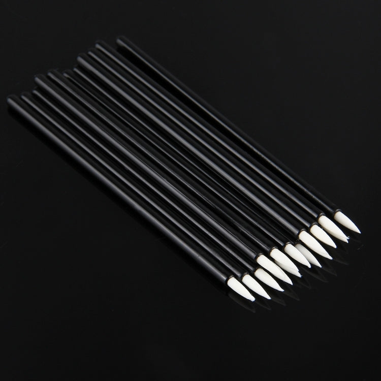 Close-up of black eyeliner brushes with white angled tips