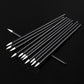 Angled view of black eyeliner brushes with pointed white bristles