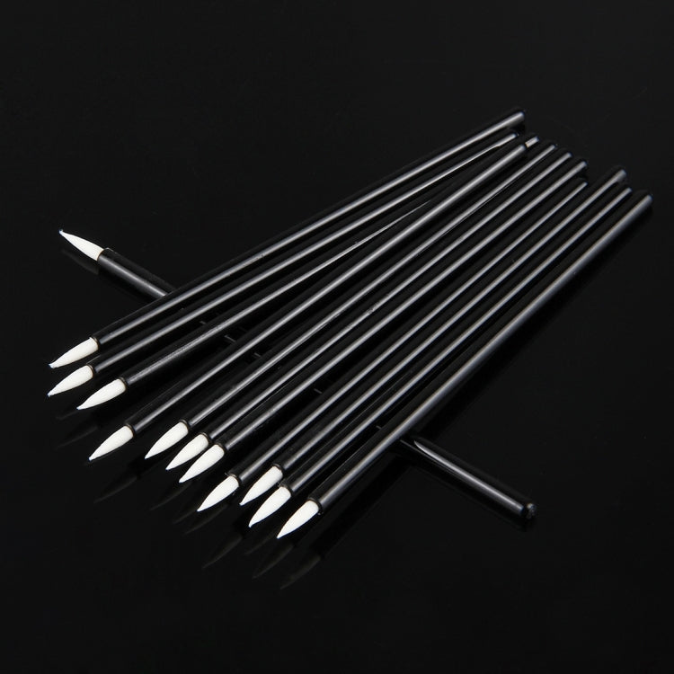 Angled view of black eyeliner brushes with pointed white bristles