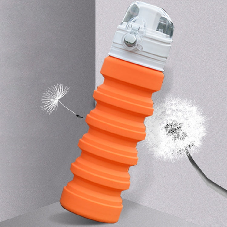Orange telescopic foldable silicone drinking bottle with clear flip spout and white ring