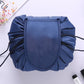 Navy blue drawstring cosmetic storage bag with rounded front panel and cords