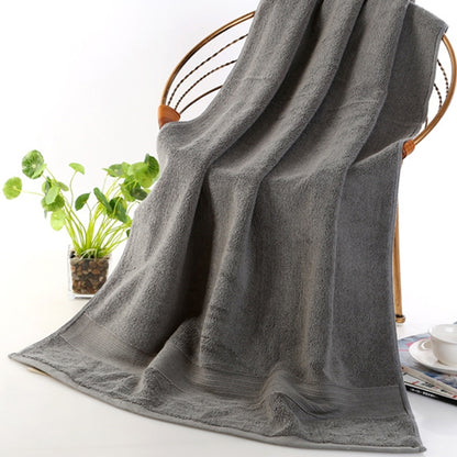 Thick grey cotton bath towel, large folded terry loop pile