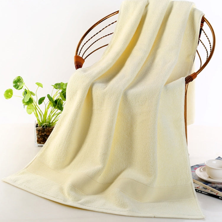 Thick beige (cream) cotton bath towel with folded striped appearance