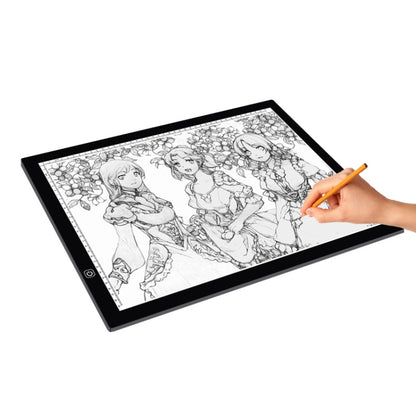 Ultra-thin LED light pad with black frame, showing anime sketch and drawing hand