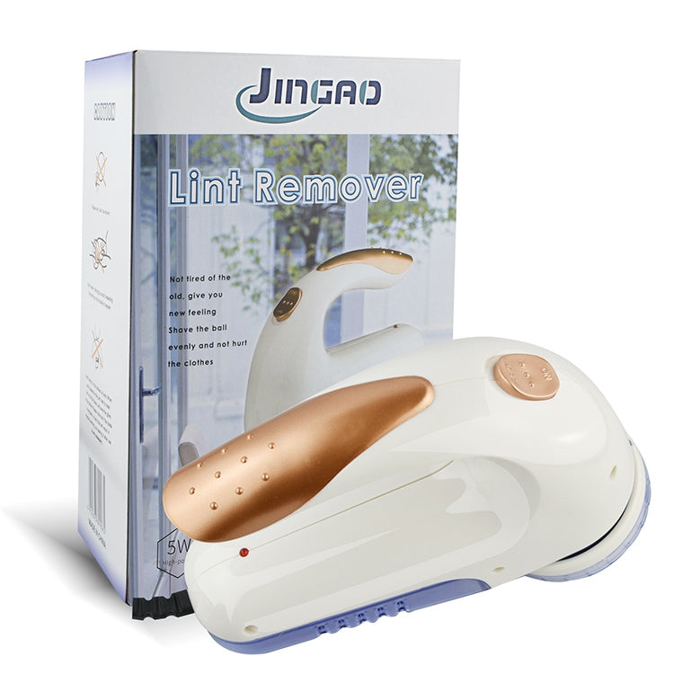 Electric fur ball trimmer in retail box, white body with clear blue head and copper control