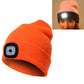 Orange knit beanie hat with front LED light module