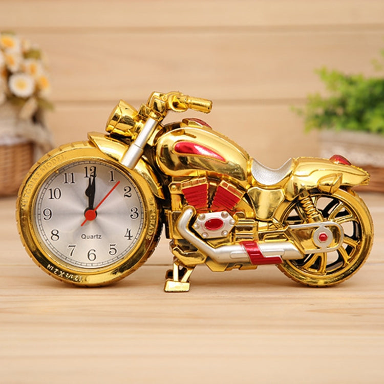 Gold motorcycle alarm clock with red tank detail and analog face with red hands