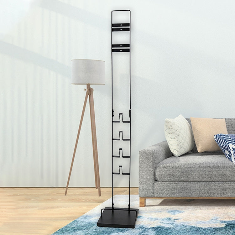 Freestanding black vacuum cleaner hanger rack with accessory hooks and square base.