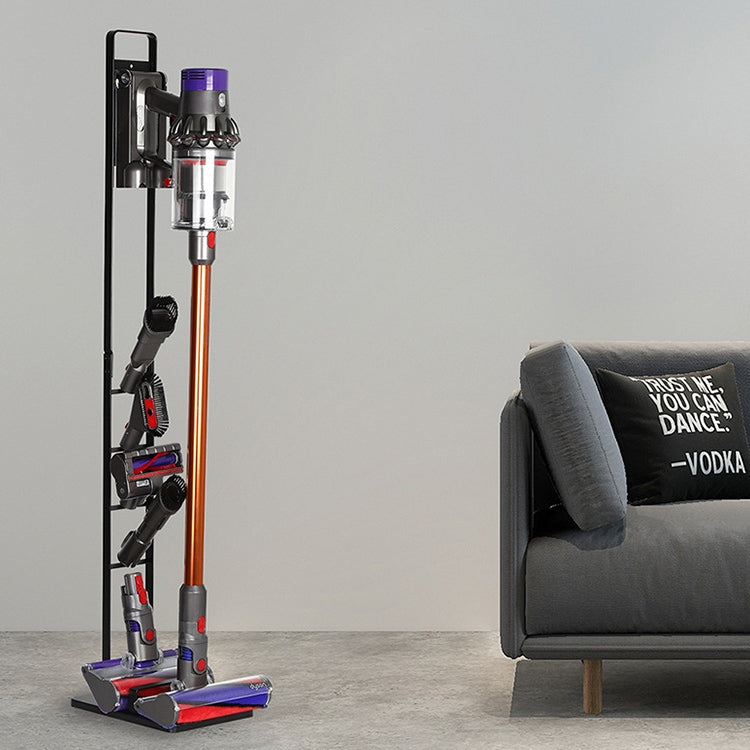 Black vacuum cleaner storage rack with base, holding a cordless stick vacuum upright.