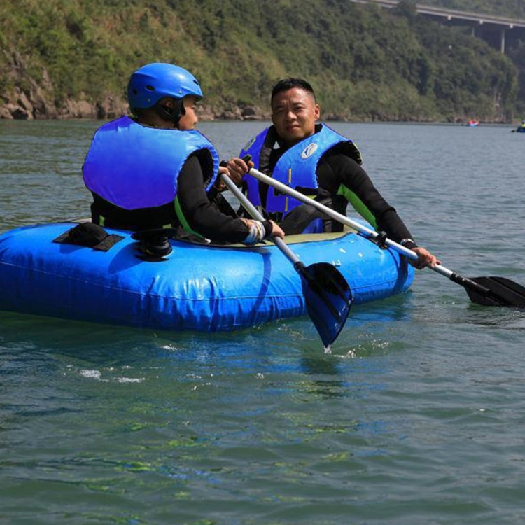 Adult life jacket in blue with black straps on a raft