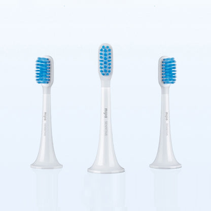 Set of 3 electric toothbrush replacement heads with white handles and blue bristles