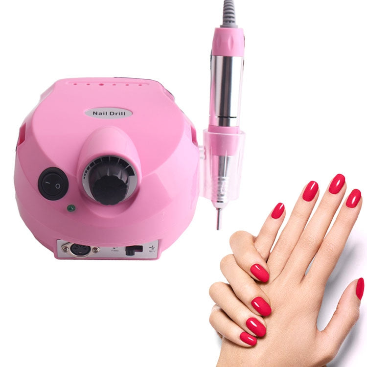 Pink nail drill machine with pink-and-silver pen handle and cord, with red manicured nails
