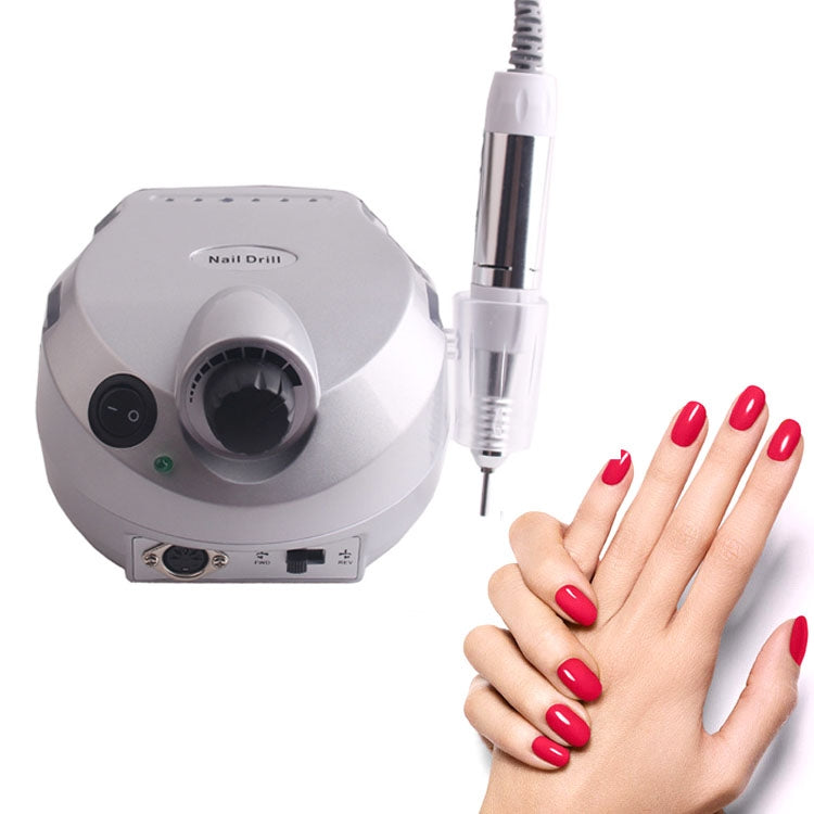 White electric nail drill with handpiece and clear grinding tip for nail styling