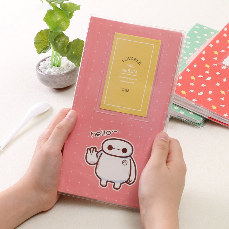 Mini photo album with Baymax-style character on pink cover, heart-themed title card.