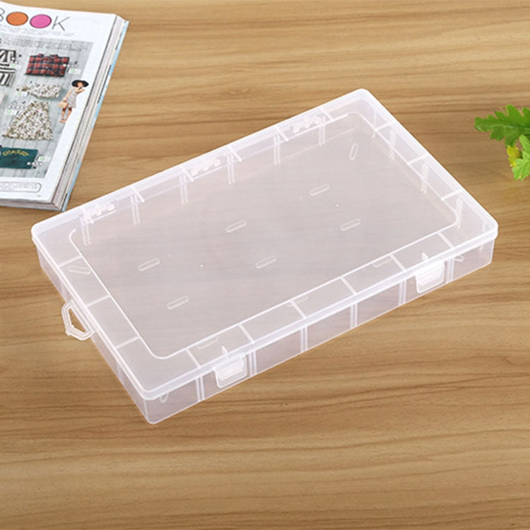 Clear plastic organizer box with removable grid compartments and side carrying handle