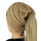 Cable-knit ponytail cap beanie in brown with back opening for a high ponytail.