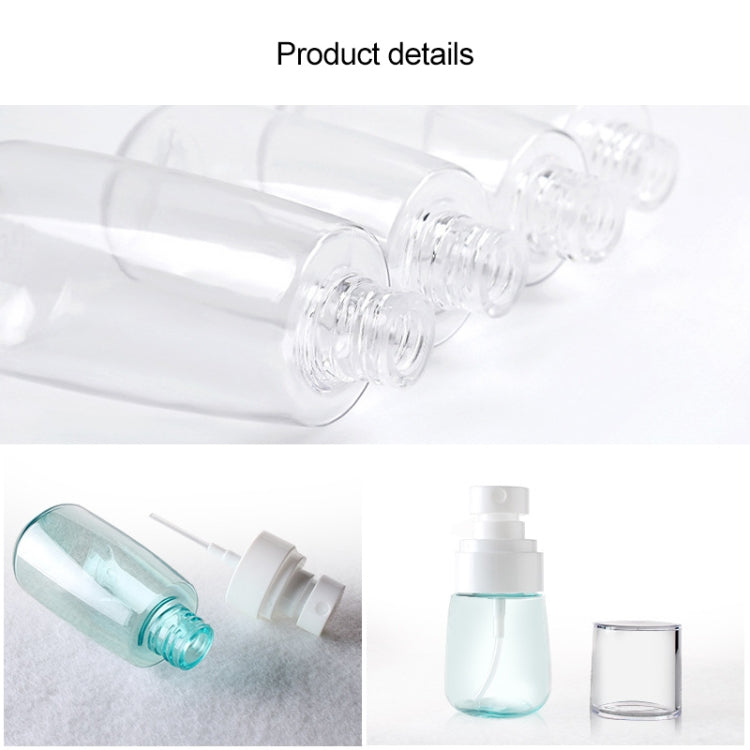 Transparent refillable spray bottle with white pump head and fine-mist nozzle detail