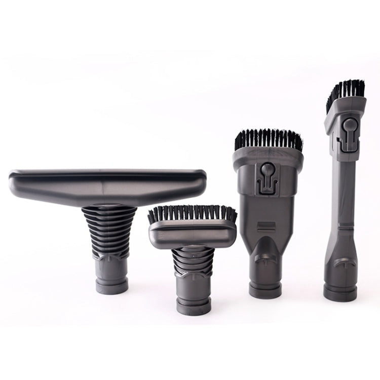 Grey vacuum brush head set with black bristles, including round and floor nozzle tools