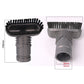 Round grey vacuum brush head with black bristles and open nozzle, close-up