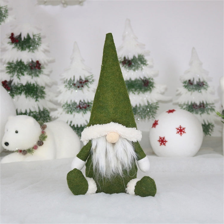 Green felt gnome window ornament with white fur-trimmed hat and long white beard