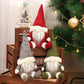 Set of three felt gnome window ornaments in green, grey, and red with white beards