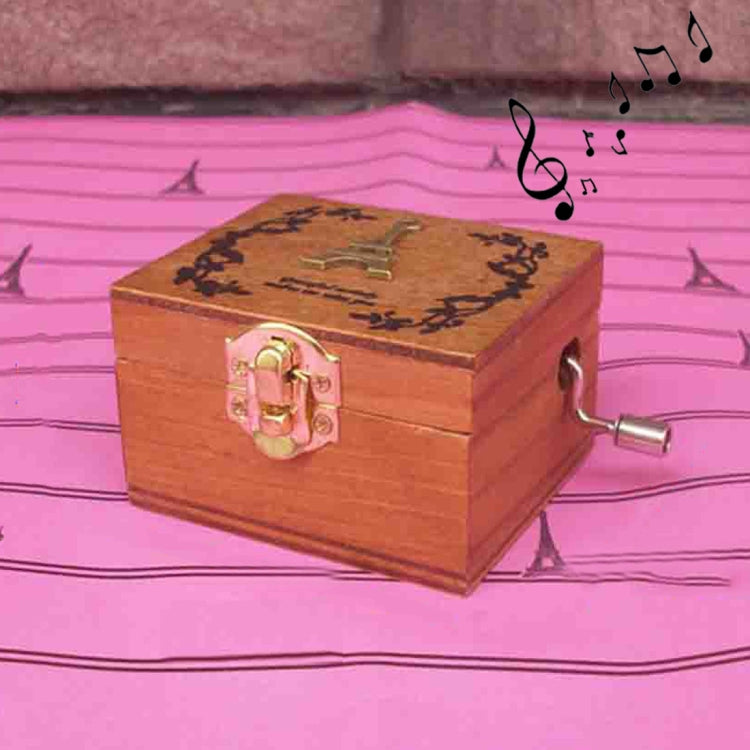 Wooden music box with engraved lid, pink lock, and side winding crank