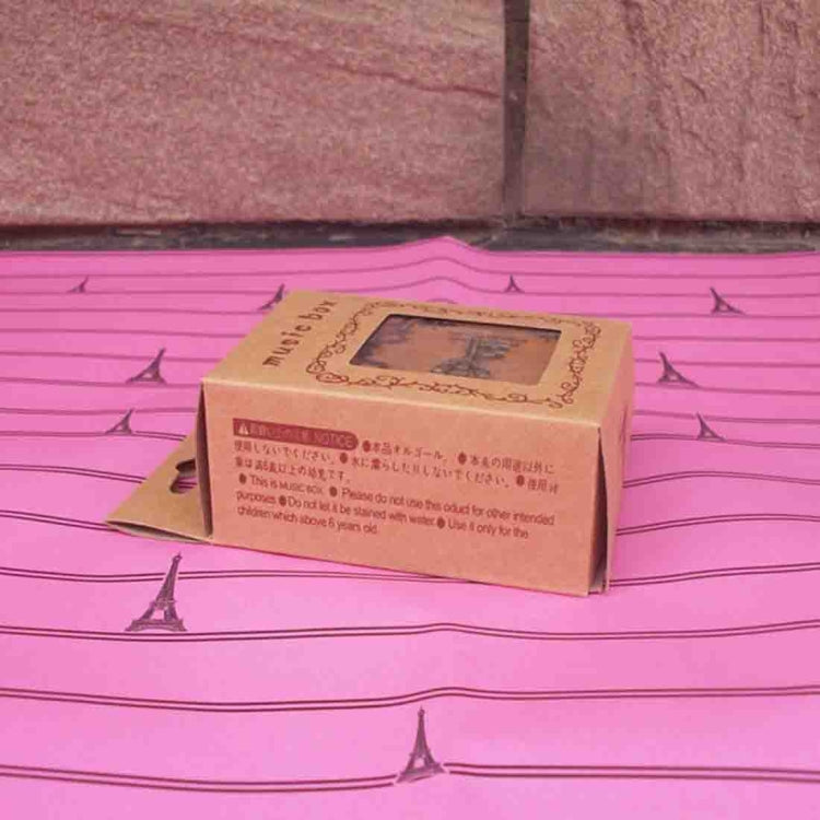 Wooden music box in kraft box with printed label and clear window