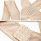 Flesh-toned shoulder support with breathable mesh panels and front hook-and-eye closure