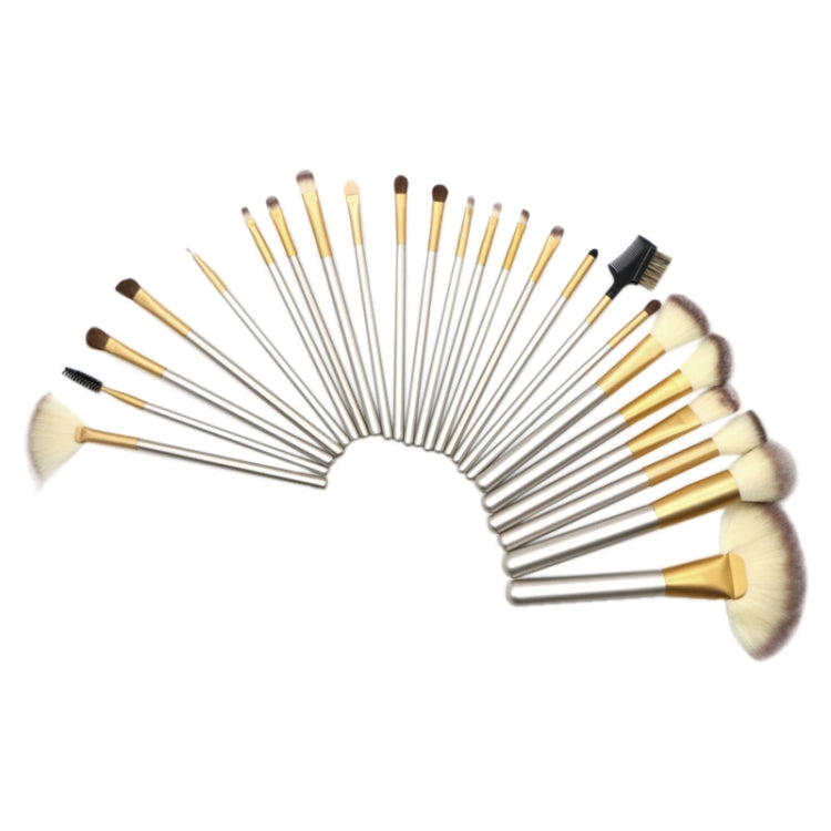 Makeup brush set fanned in semicircle, assorted beige bristles with a black spool brush