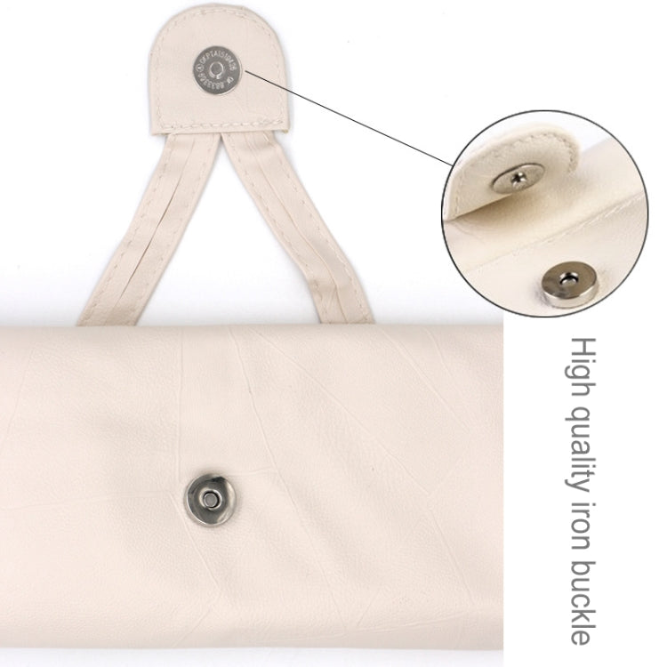 Beige makeup brush roll pouch with snap button closure and fabric carrying straps