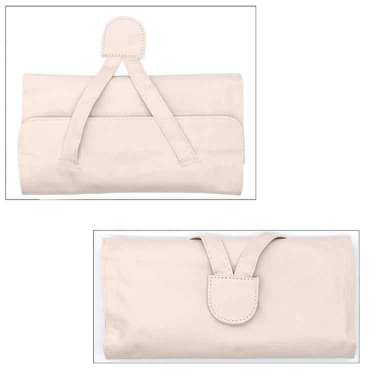 Beige makeup brush roll pouch with front flap, pocket, and top carry handle strap
