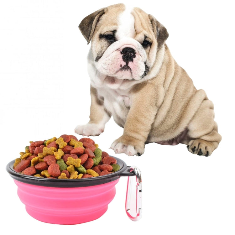 Foldable silicone pet bowl, pink with kibble inside and metal clip handle