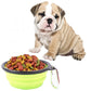 Foldable silicone pet bowl, neon green with kibble inside and metal clip handle