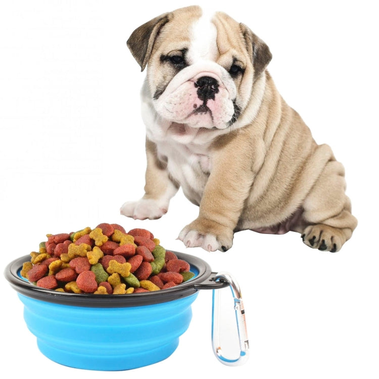 Foldable silicone pet bowl, blue with kibble inside and metal clip handle