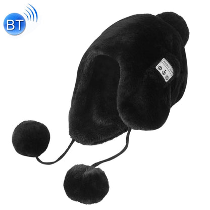 Black plush winter hat with ear muffs, pom-poms, and small control panel on side