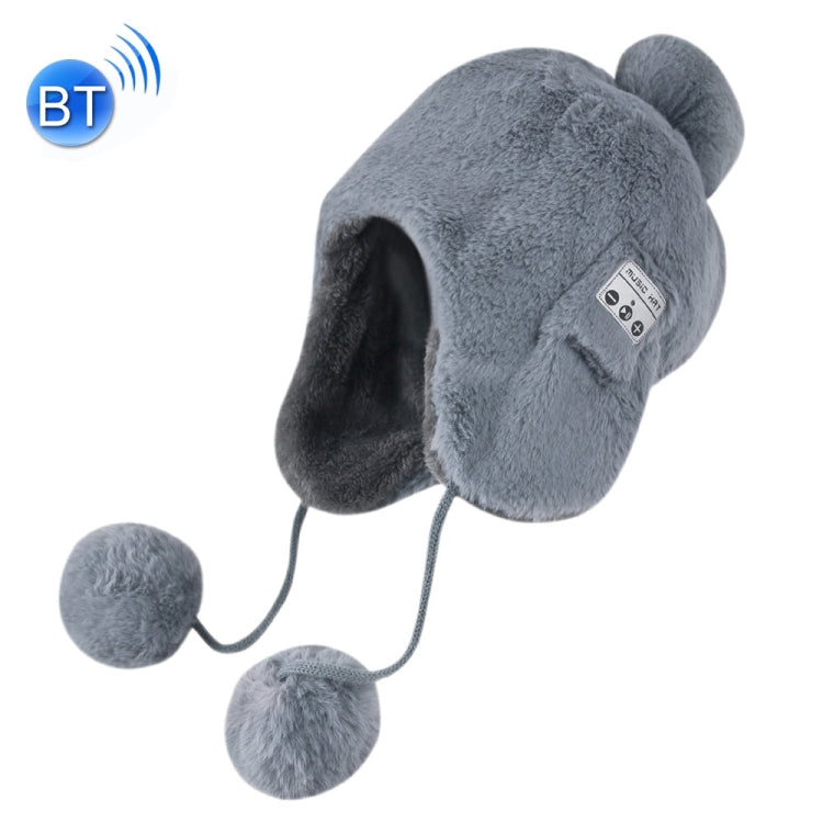 Grey plush winter ear-muff hat with pom-poms and small control panel on side